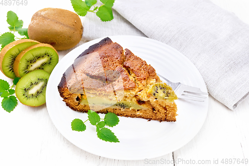 Image of Pie with kiwi in plate on light board