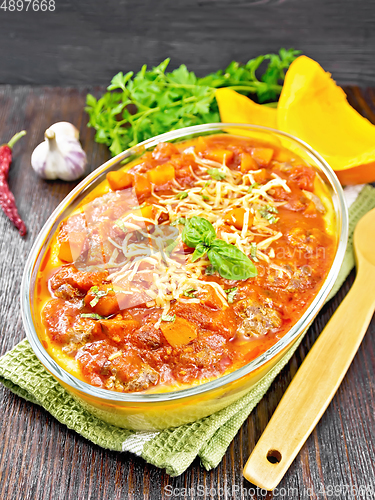 Image of Porridge corn with meat and vegetables in roaster on napkin