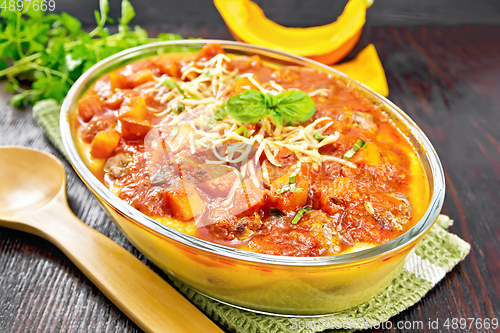 Image of Porridge corn with meat and vegetables in roaster on table