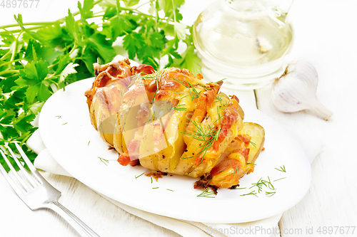 Image of Potatoes puff bacon in plate on light board