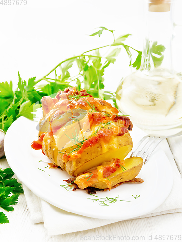 Image of Potatoes puff bacon in plate on napkin