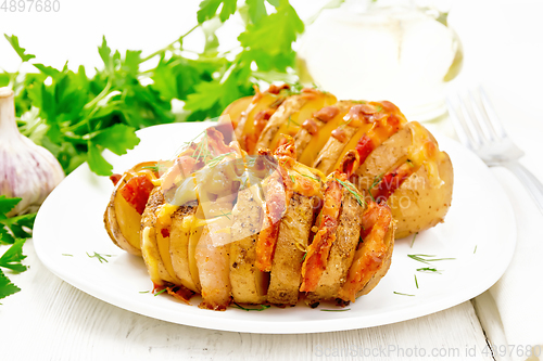 Image of Potatoes puff smoked bacon in plate on board