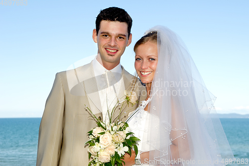 Image of Happy wedding couple smiling