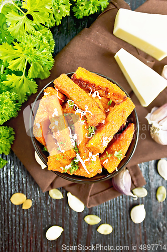 Image of Pumpkin fried with spices in bowl on board top