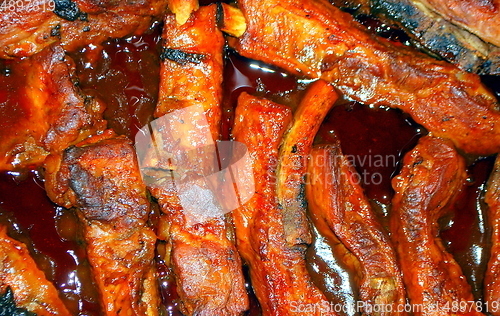 Image of Barbecue ribs being cooked.