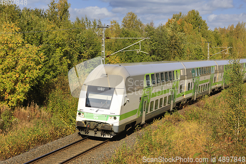 Image of VR Group Intercity Train at Speed in Autumn