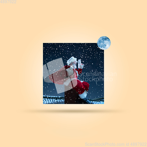 Image of Emotional Santa Claus greeting with Christmas and New Year 2021. Copyspace, design, art collage.