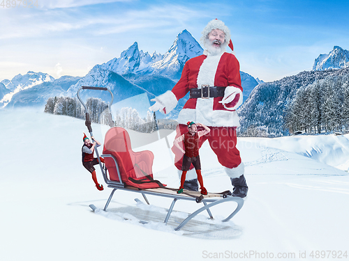 Image of Emotional Santa Claus and elfs greeting with Christmas and New Year 2021. Copyspace, design, art collage.