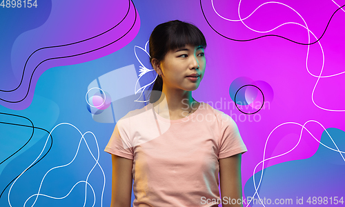 Image of Asian young woman\'s portrait isolated on bright, modern illustrated background.