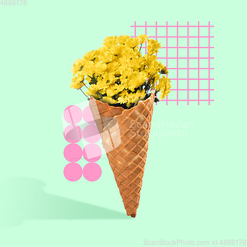 Image of Contemporary art collage. Ice cream cone filled with yellow golden-daisy on blue-green background. Modern design.
