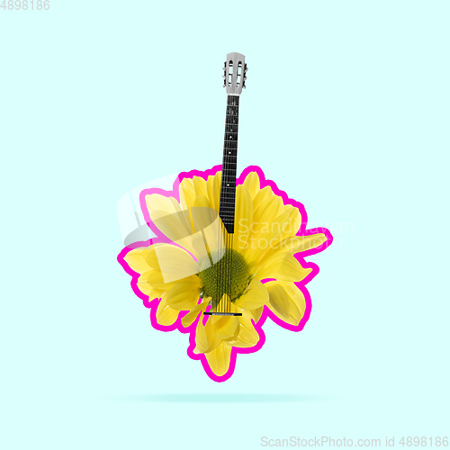 Image of Contemporary art collage. Yellow flower with pink outline as a body of acoustic guitar on light background.