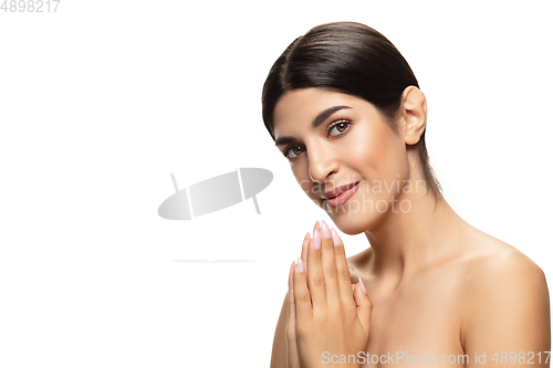 Image of Portrait of beautiful jewish woman isolated on white studio background. Beauty, fashion, skincare, cosmetics concept.