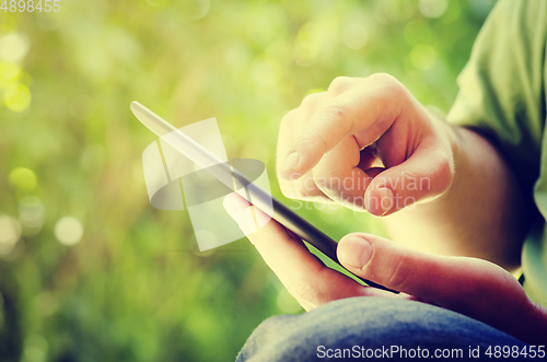 Image of Man holding tablet