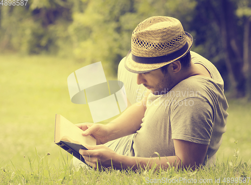 Image of Man reading a book