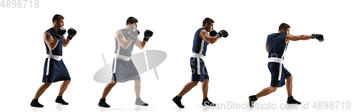 Image of Young boxer against white studio background in motion of step-to-step kicking