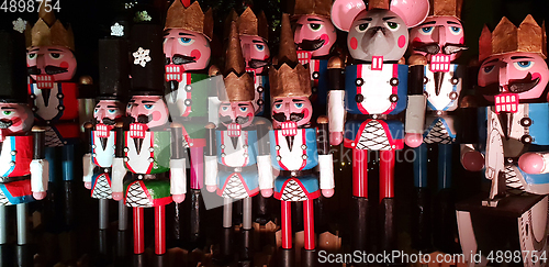 Image of Wooden nutcracker statues standing in a row as a Christmas decor