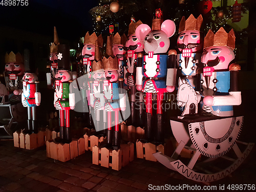 Image of Wooden nutcracker statues standing in a row as a Christmas decor