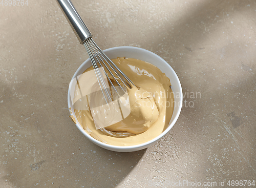 Image of bowl of whipped instant coffee with sugar and water