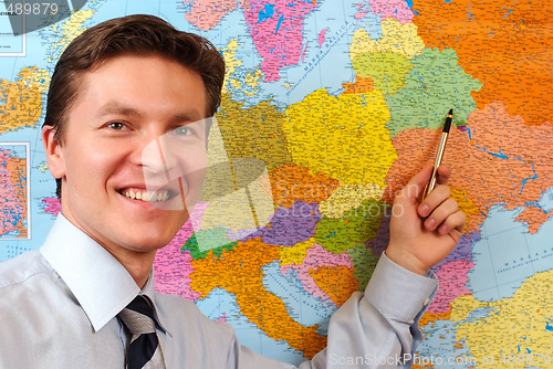 Image of Businessman pointing on the map