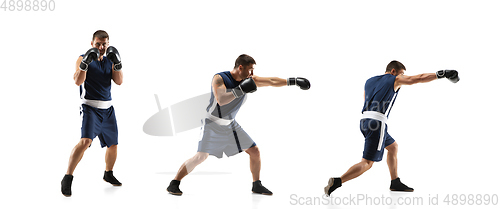 Image of Young boxer against white studio background in motion of step-to-step kicking