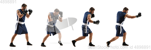 Image of Young boxer against white studio background in motion of step-to-step kicking