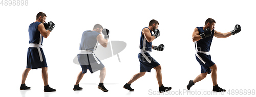 Image of Young boxer against white studio background in motion of step-to-step kicking