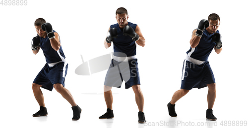 Image of Young boxer against white studio background in motion of step-to-step kicking