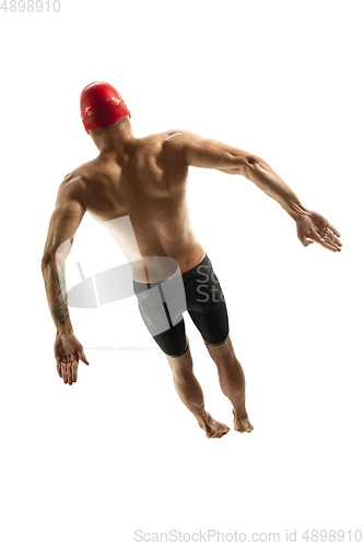 Image of Caucasian professional sportsman, swimmer training isolated on white studio background
