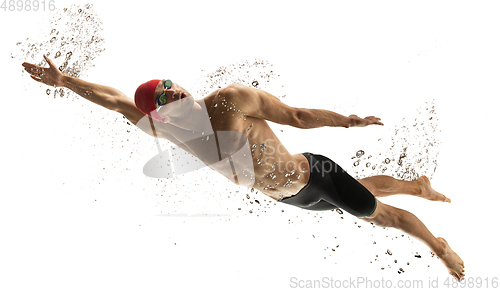 Image of Caucasian professional sportsman, swimmer training isolated on white studio background