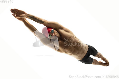 Image of Caucasian professional sportsman, swimmer training isolated on white studio background