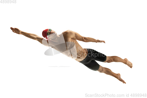 Image of Caucasian professional sportsman, swimmer training isolated on white studio background