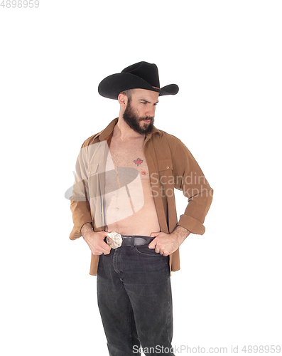 Image of Young man with open shirt and cowboy hat