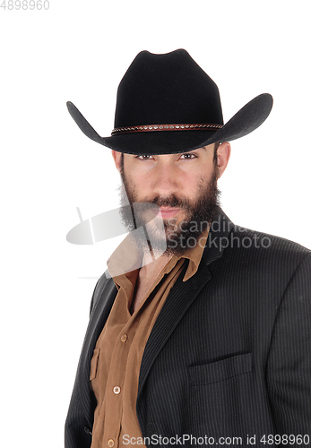 Image of Man in striped jacket and cowboy hat, in a portrait image