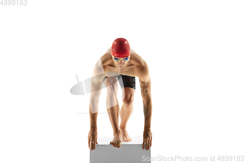 Image of Caucasian professional sportsman, swimmer training isolated on white studio background