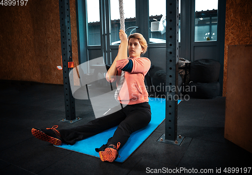 Image of Disabled woman training in the gym of rehabilitation center