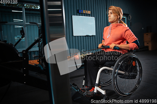 Image of Disabled woman training in the gym of rehabilitation center