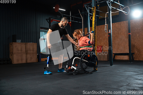 Image of Disabled woman training in the gym of rehabilitation center