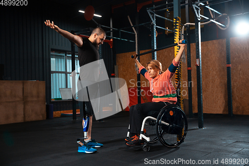 Image of Disabled woman training in the gym of rehabilitation center