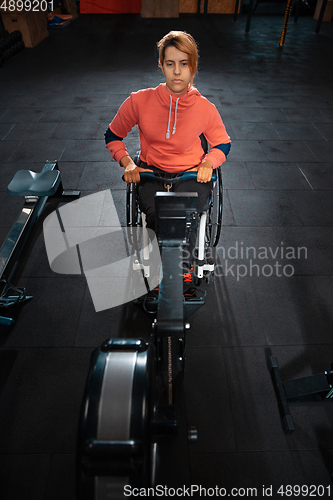 Image of Disabled woman training in the gym of rehabilitation center