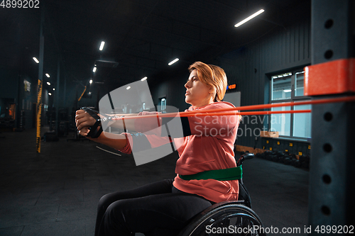 Image of Disabled woman training in the gym of rehabilitation center