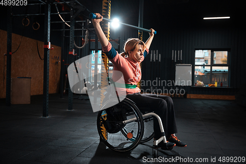 Image of Disabled woman training in the gym of rehabilitation center