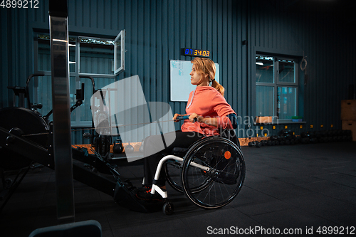 Image of Disabled woman training in the gym of rehabilitation center