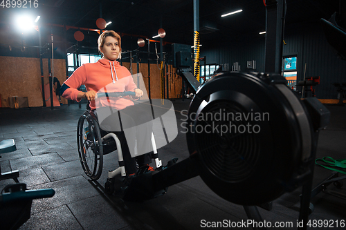 Image of Disabled woman training in the gym of rehabilitation center