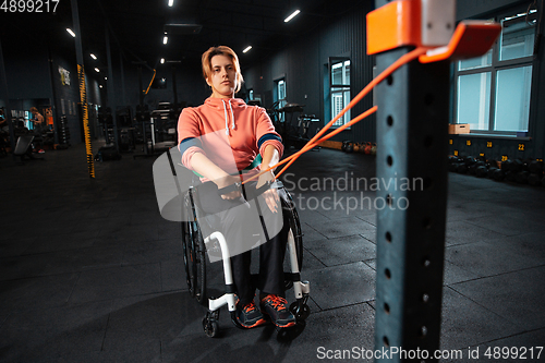 Image of Disabled woman training in the gym of rehabilitation center