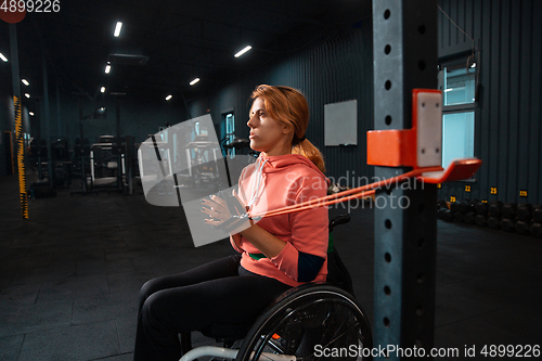 Image of Disabled woman training in the gym of rehabilitation center