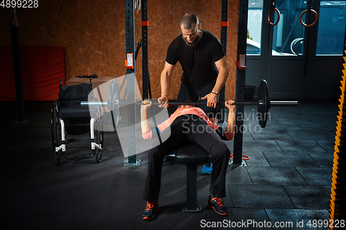 Image of Disabled woman training in the gym of rehabilitation center