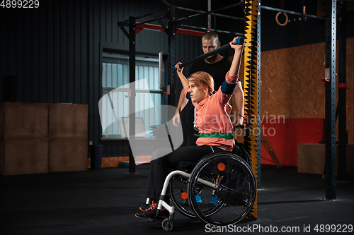 Image of Disabled woman training in the gym of rehabilitation center