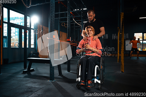 Image of Disabled woman training in the gym of rehabilitation center