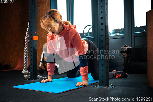 Image of Disabled woman training in the gym of rehabilitation center