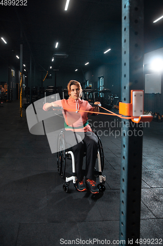 Image of Disabled woman training in the gym of rehabilitation center